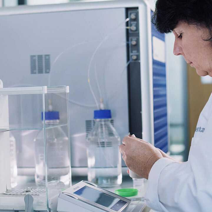 Woman weighing samples in a laboratory