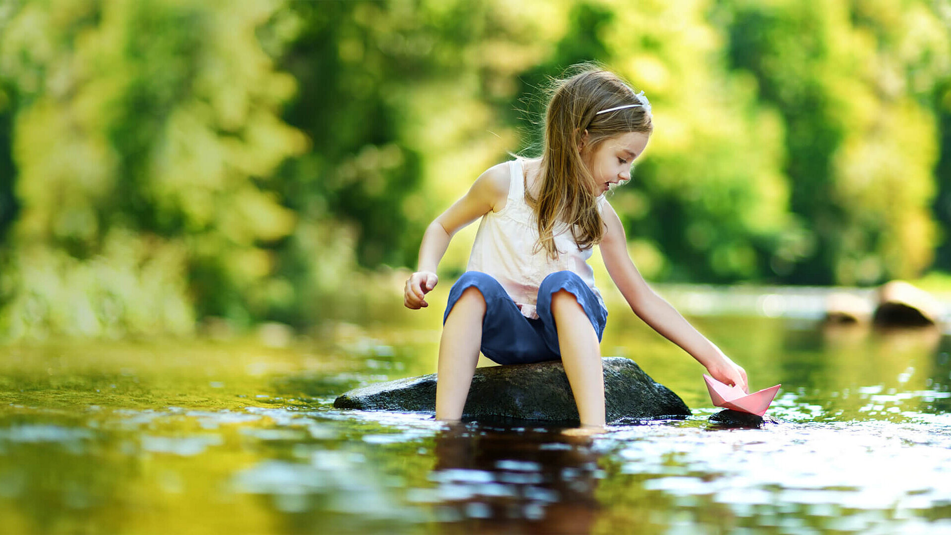 Girl playing at the water